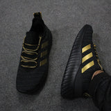 Strips Design Sneakers For Men's Black & Golden | 24hours.pk